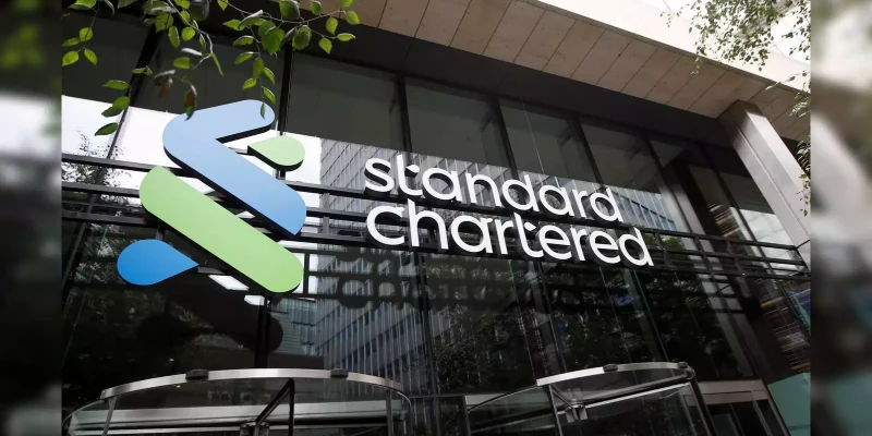 Professional team meeting at Standard Chartered with focus on TMT Cash Sales