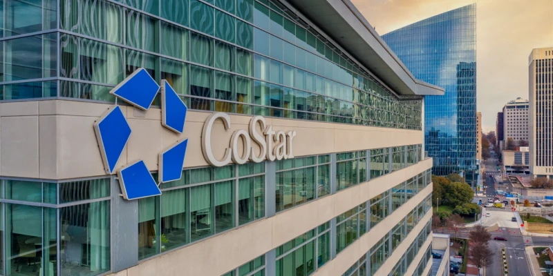 CoStar Group hiring Professional real estate sales executive presenting analytics data in a modern San Francisco office